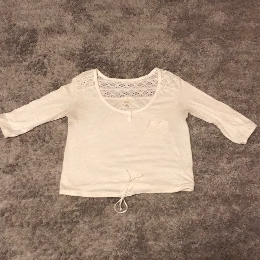 Quarter length cropped shirt.